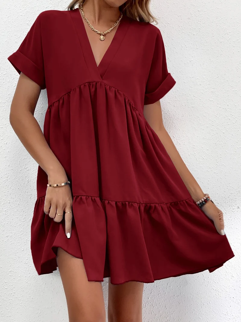 Kurzes, gesmoktes Kleid mit Volants | La Parisienne