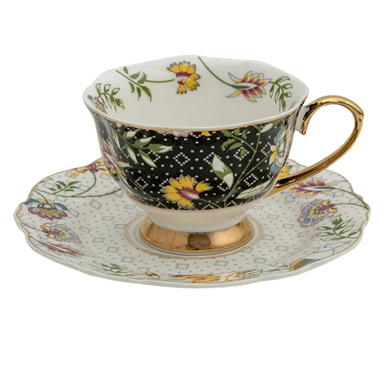 Tasse und Untertasse in Schwarz-Weiß mit Golddetail